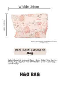 Detail of red floral toiletry bag showing 26x18cm size and canvas lining texture