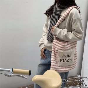 Pink and white striped fuzzy tote bag with FUN PLACE embroidery detail on front pocket