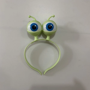 Light green LED alien headband featuring large blue eyes and anti-slip tooth design