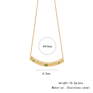 Detailed view of irregular gold pleated necklace with three green gems and measurements