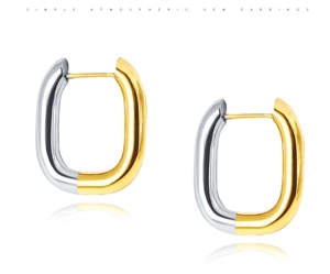 Polished two-tone gold and silver U-shaped hoop earrings with minimalist metal texture