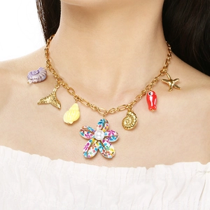 Golden summer ocean theme necklace with shell, starfish and pearl flower pendants