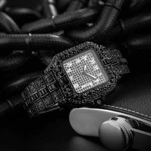 Detailed view of luxury square black dial watch fully iced out with dark crystals