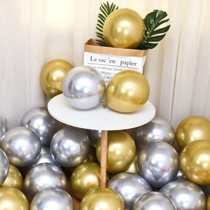 Close-up of premium thickened gold and silver metallic latex balloons for party decoration