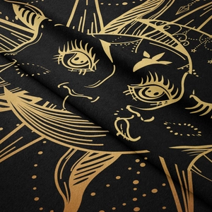 Detailed view of bohemian mandala tapestry featuring gold celestial sun and star patterns