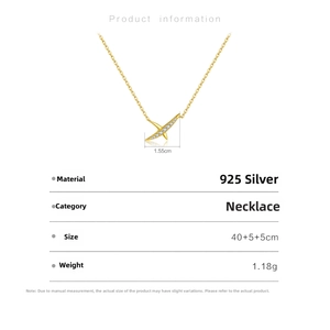 Detail of 925 silver gold necklace with geometric cross pendant and cubic zirconia