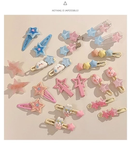 Flat lay of colorful Y2K macaron star and cartoon animal hair clips on white background