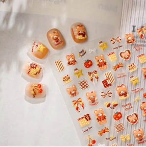 Detail of caramel honey bear nail stickers with vintage heart and star motifs