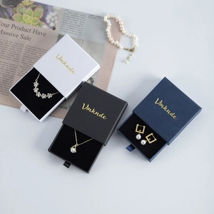Detailed view of high-quality drawer jewelry gift boxes with gold logo and soft lining