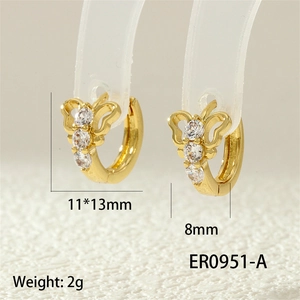 Detail view of gold butterfly earrings with cubic zirconia stones and size measurements