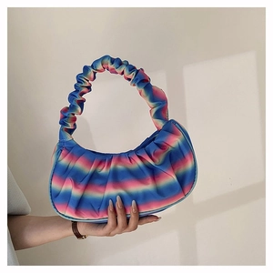 Detail of colorful rainbow pleated dumpling bag with soft ruched handle and silky texture