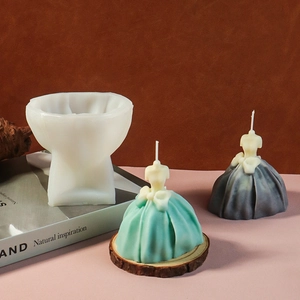 Detail of DIY wedding dress silicone candle mold with finished mint green and grey candles