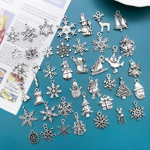 Detailed macro view of vintage silver Christmas alloy charms for DIY jewelry making