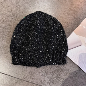Sparkly black sequined beanie hat for women featuring high-density reflective knit fabric