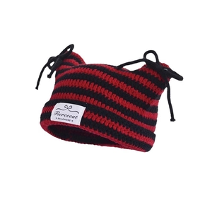 Striped knit cat ear beanie with red and black pattern and bow tie detail