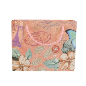 Sac cadeau en papier motif Tour Eiffel et fleurs avec poignées roses pour le shopping
