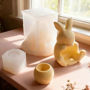 Detail of bunny and striped vessel silicone molds with finished plaster handicrafts