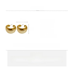 Detail view of gold chunky hoop earrings showing 3cm size and hammered texture design