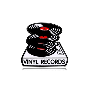 Vintage vinyl record player enamel pin badge with white base and black vinyl record layers