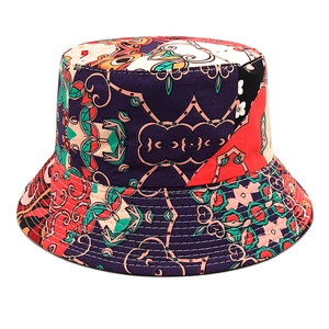 Detailed view of colorful bohemian pattern stitching and reinforced brim on bucket hat
