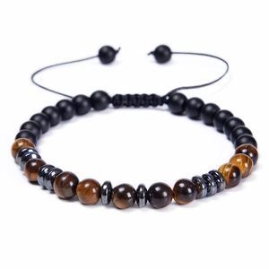 Detail of tiger eye and matte black beads with hematite spacers on adjustable cord