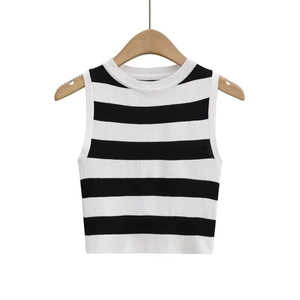 Detailed view of sleeveless black and white striped knit tank top on wooden hanger