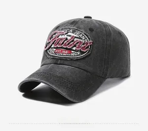 Close-up of vintage embroidery and washed grey cotton fabric on the baseball cap detail