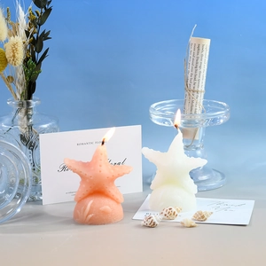 Détails de bougies décoratives en forme d'étoile de mer orange et blanche avec coquillages