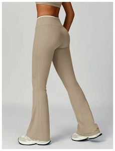 Detail view of khaki high-waisted flared yoga pants with premium elastic fabric texture