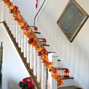 Autumn artificial maple leaf garland featuring orange red yellow foliage for home decor