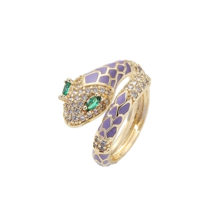Unique brass snake-shaped ring with purple enamel scales and green gemstone eyes