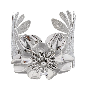 Polished silver metal open cuff bracelet featuring an intricate 3D blooming floral design