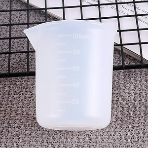 Macro shot of 100ml translucent silicone measuring cup with clear scale for DIY resin art