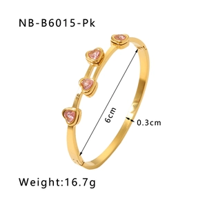 Detail view of 18K gold plated heart bangle with pink zircon stones and dimension labels