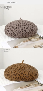 Detailed close-up of leopard print wool berets in grey and caramel tones for autumn