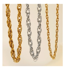 Close-up of gold and silver twisted rope chains in polished stainless steel finish