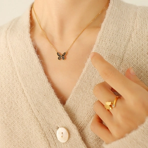 Parure bohème avec collier papillon doré en émail noir et bague ajustable ornée de zircons