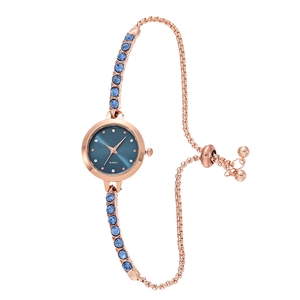 Rose gold quartz watch with dark blue dial and crystal bracelet on white background