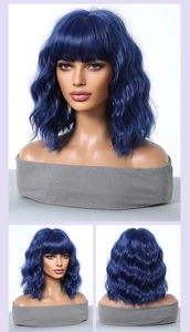 Multiple views of a blue shoulder-length wavy bob wig with bangs on a mannequin head