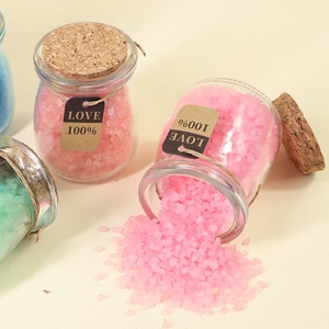 Pink and green Himalayan bath salt crystals in glass jars with cork lids and heart tags
