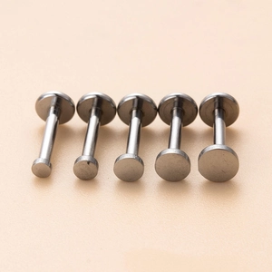 Set of 5 stainless steel flat back stud piercings in various sizes with silver finish