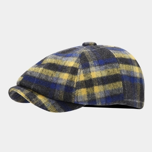 British style wool blend newsboy cap with vibrant colorful plaid pattern shown at 45-degree angle