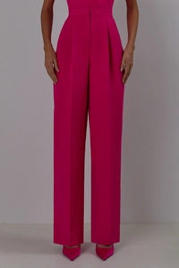 Detailed view of high-waist rose red wide-leg suit trousers with a premium drape finish