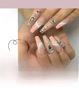 Detailed view of pink and white long coffin press-on nails with rhinestones and art