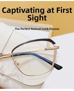 Detailed close-up of mixed-color cat-eye frame glasses on a white leather case
