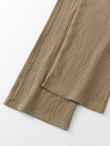 Detailed macro view showing the unique seersucker texture of khaki mens two-piece set fabric