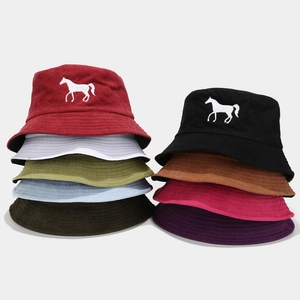 Detail of corduroy bucket hats in nine colors featuring fine white horse embroidery