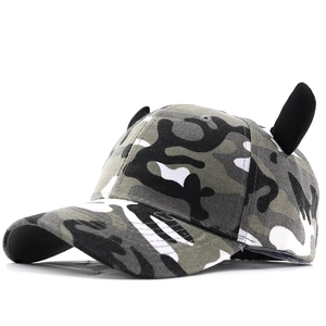Camouflage baseball cap with black horn ears decoration in a 45-degree side view
