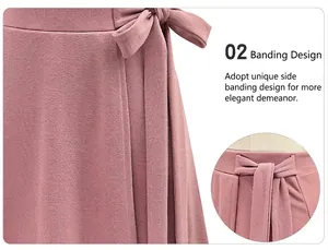 Detailed view of the side lace-up bow and textured fabric on the mauve midi skirt