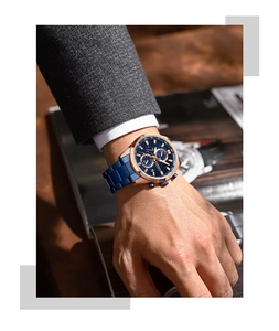Close-up of CURREN men's chronograph watch with blue dial and rose gold case on wrist